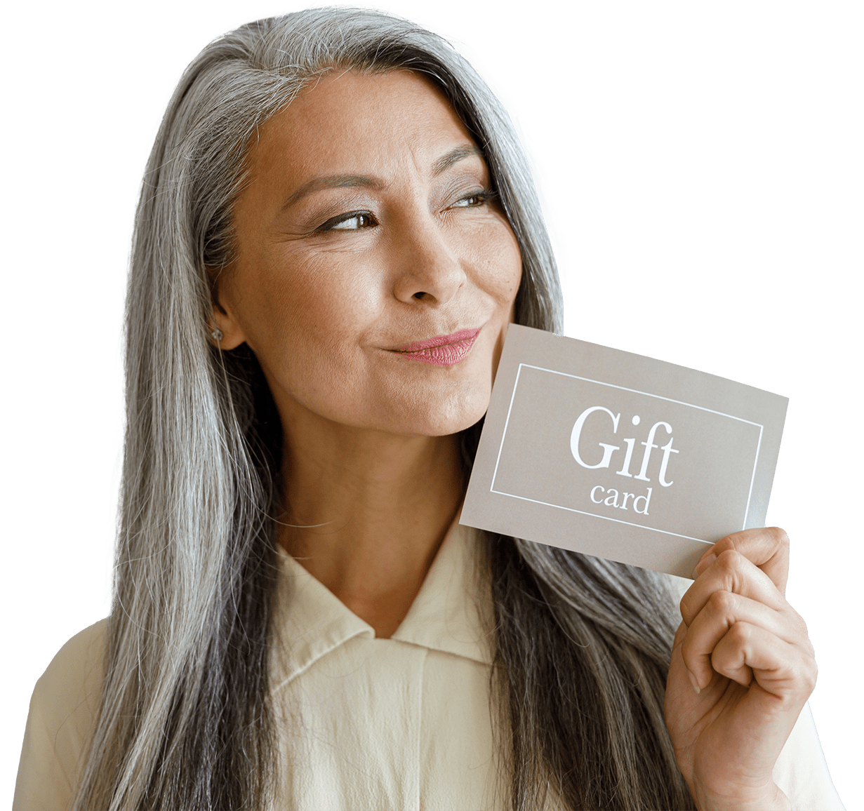 Positive silver haired Asian woman customer holds gift card standing on light grey background in studio. Shopping certificate