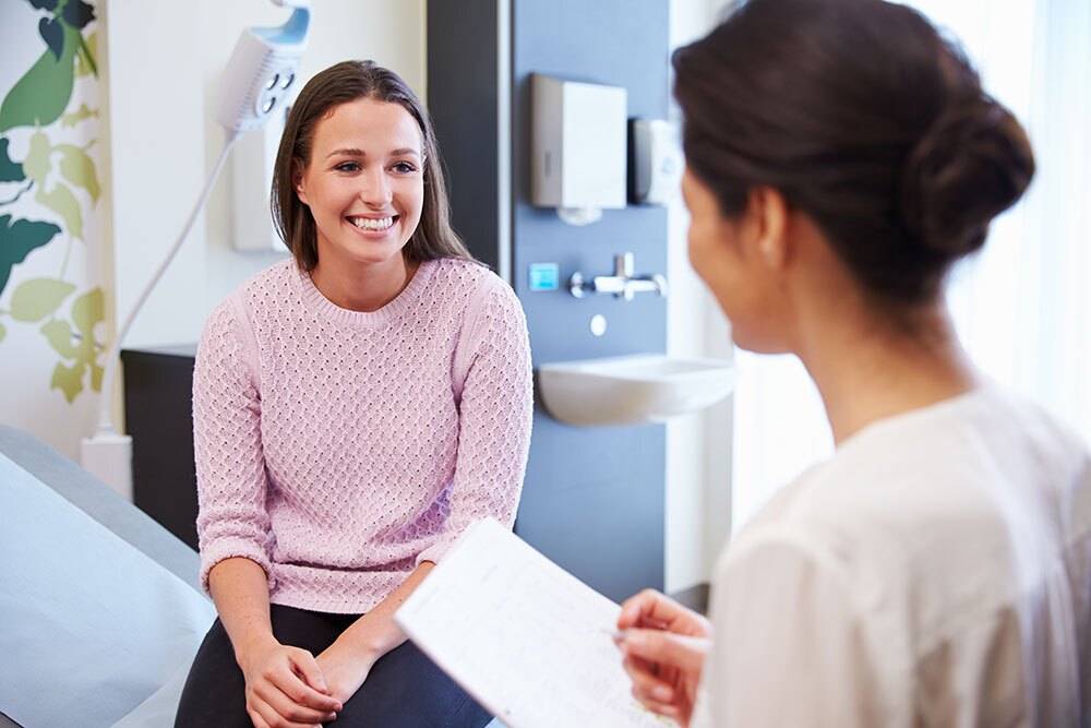 Female Patient And Doctor During Consultation